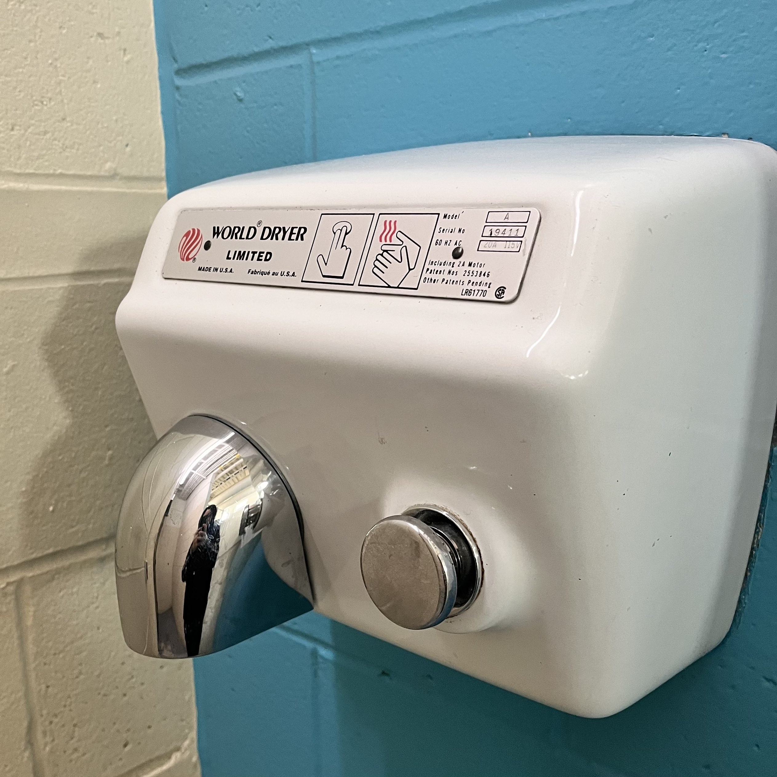 The sound of dryer in the toilet, includes the sound of pressing the button.