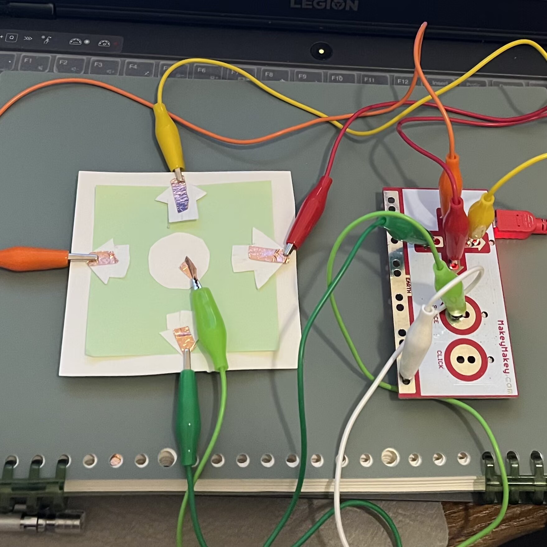 I created next circuit as a control panel, where each button corresponds to the same key on the Makey Makey. The middle button is 'space' for reset 