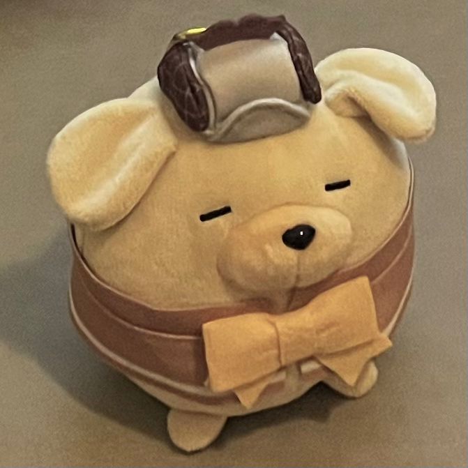 This photo of a dog plush is taken at a 3/4 view. There are several appendages on it, consider as complex geometry object.